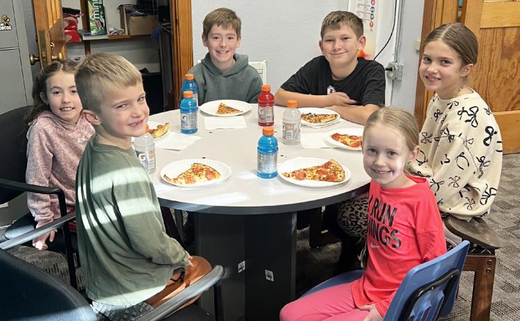 Pictured around the table, clockwise from bottom left: Tate Seeley, Addi Mundorf, Eli Garza, Cooper Phillips, Madelyn Seeley, Aurora Polt. Brett Mauler