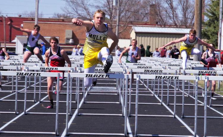 Clayton Moore and Chase Gracey (right) placed 1st and 3rd in both of the boys’ hurdle events last Thursday. Here they compete in the 110 hurdles. Barb McIntosh