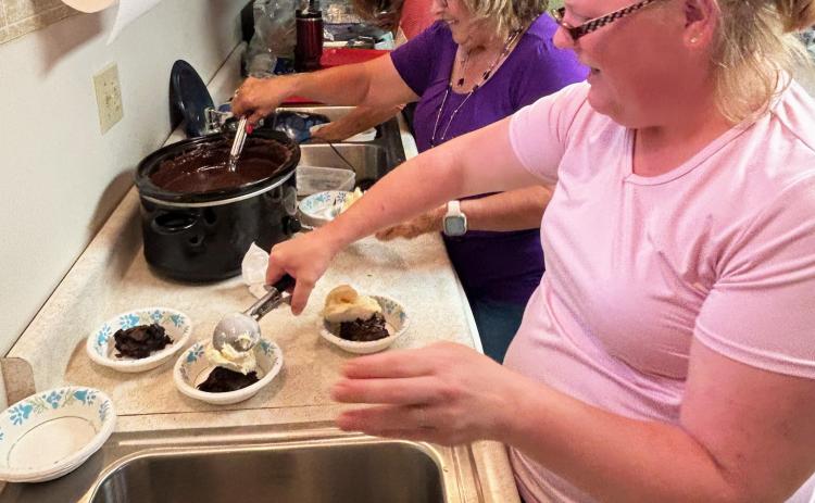 The Assembly of God Church ladies were dishing up brownies and scooping ice cream and toppings like hot fudge as fast as they could Saturday afternoon, Aug. 1, during their ice cream social! Pictured l-r: Linda Boyer, Teresa Hampton, Jamie Hart. Gerri Peterson