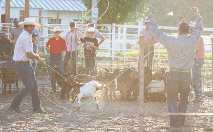 Willy Hicks and Jay Lovitt with a catch in the goat roping. Gerri Peterson