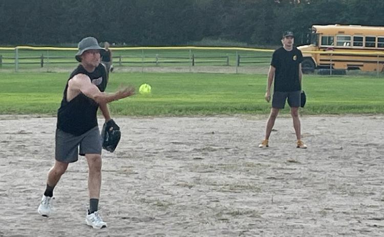 Despite the temperature earlier in the day climbing over 100, there were 22 participants in the Hooker County Fair slow pitch softball game Sunday evening, July 26. Pictured are Brandon Cooley and Jaden Emerson. Barb McIntosh
