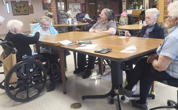 L-r: Kathleen Miles, Florence Cooper, Ann Connell, Wanda Mackley and Nadene Andersen playing Pass the Pig.