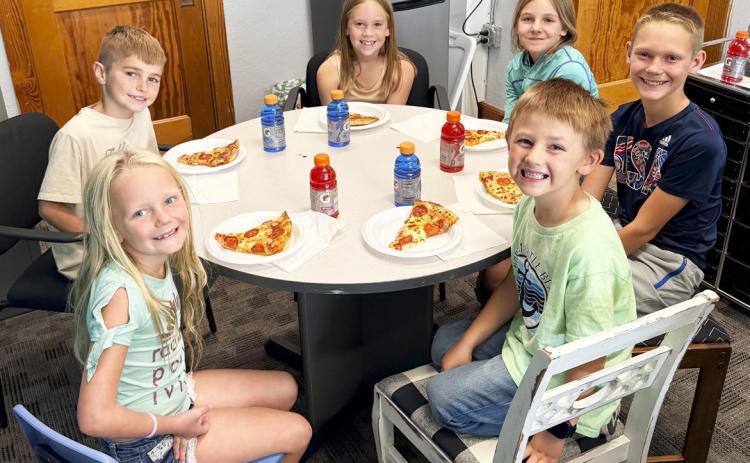 Pictured clockwise around the table from the top: Kinley Crisp, Eve Ericksen, Eli Barnes, Chasin McIntosh, Harper Barnes, Brogan Seeley. Brett Mauler