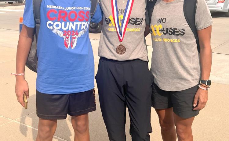 L-r: Braylon Kuncl, Kaisley Phipps and Coach Janie Kuncl at the Nebraska Junior High State Cross Country Meet. Jordyn Phipps