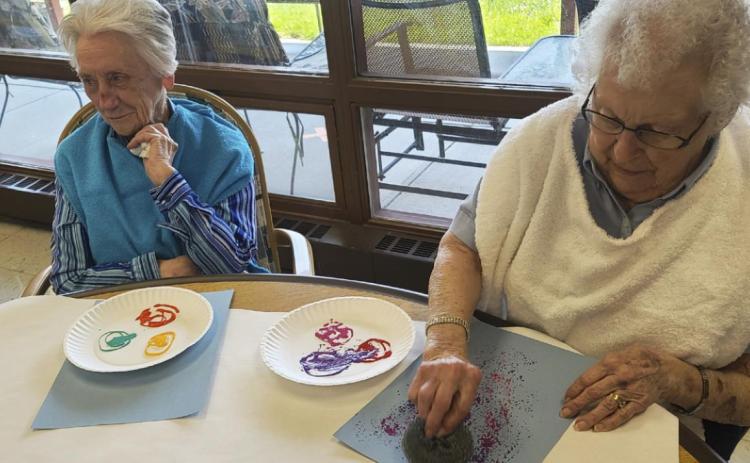 Wanda Mackley (left) and Nadene Andersen during arts and crafts.