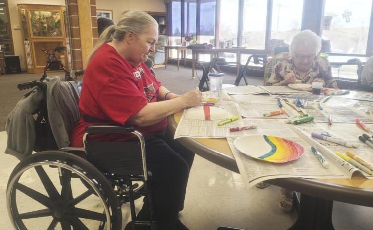 Ann Connell (left) and Nadene Andersen during crafts.