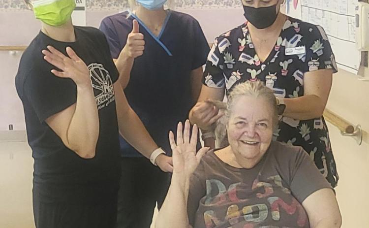 Ann Connell is such a great sport. L-r: CNAs Kelsey Pettit, Lindey Coble and Amanda Vinton were trying a new braid on her hair while Ann was waiting for her daughter’s visit. Ann has beautiful hair.