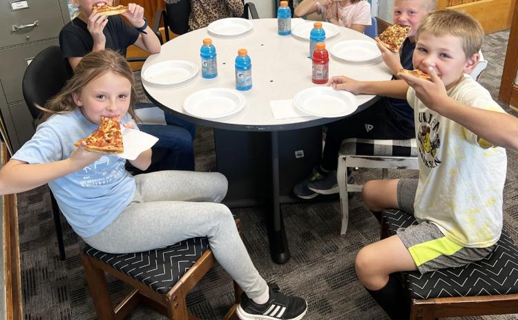 L-r around the table: Sadie Hoyt, Ayden Lee, Charlotte Connealy, Nora Pohot, Finnegan Connealy, Tripp Jewell. Brett Mauler