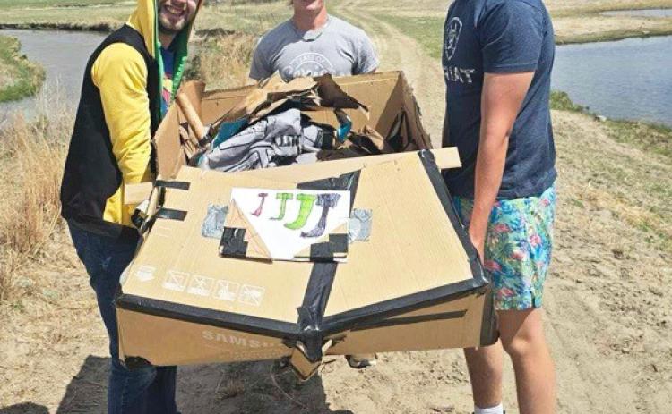 Last Wednesday, April 30 was the annual race of the cardboard boats. Juniors in Earth Science and seniors in Standards Science were challenged with engineering a two passenger boat made of only cardboard and one roll of duct tape. Three of seven boats made it across the pond with the winners, Jacob Wingebach, Justin French and Jarren Forsen (pictured above l-r), making it in 58 seconds. courtesy photos