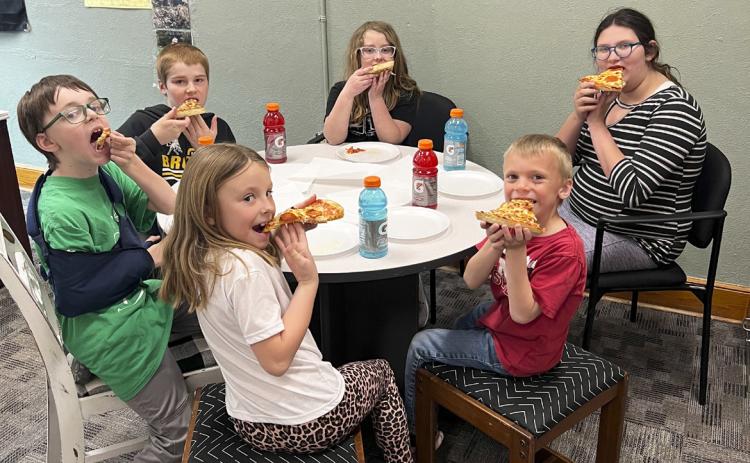 Clockwise around the table from the far back: Taylor Cash, Pandora Gray, Trent Cox, Sadie Hoyt, Samuel Hessin, Justin Kraus. Brett Mauler