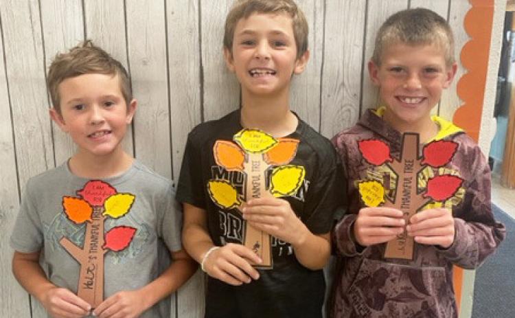 Emily Brown The 2nd and 3rd grade students made Thankful Trees. They added leaves to show the things they are thankful for. Pictured l-r: Holt Morrison, Tuff Pettit, Luke Cox.