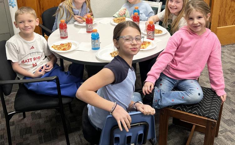 Pictured clockwise around the table from the left: Jaxson Barnes, Elle Gracey, Harper Myers, Marki Finney, Eve Ericksen, Keira Kearns. Brett Mauler