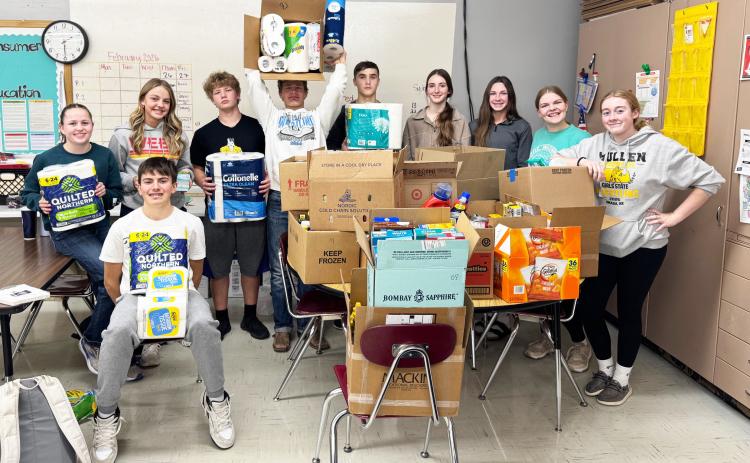 The freshman class is pictured with some of the donations to the Mullen Food Pantry, l-r: Audrabell Werth, Braylon Kuncl, Kaisley Phipps, DJ Coetzee, Cody Walker, Bo Pettit, Jr., Abby Gracey, Breckyn Burney, Maci Walz, Kassidy Cheever. Kelli Walz