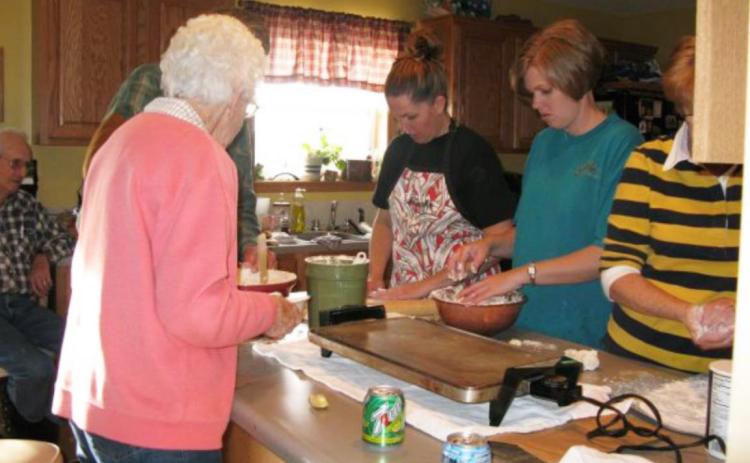 The late Beth Harding gives instructions on how to make lefse to her granddaughters Jennifer Peters (center) and Mary Jo Walker in 2009.