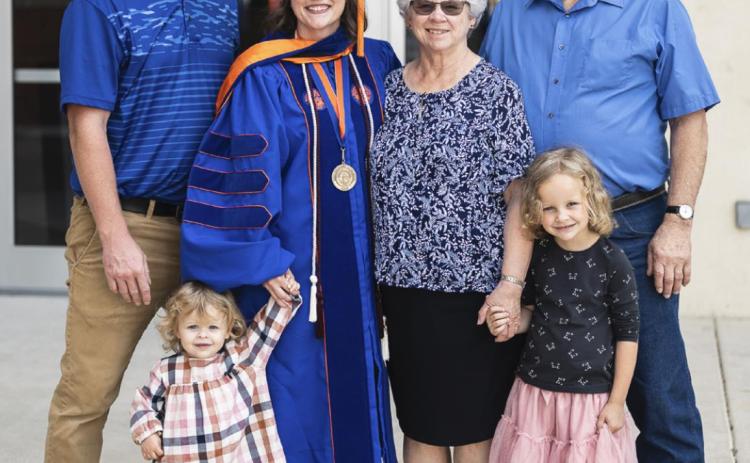 Simon, Melissa, Evelyn and Maelle Fenton with Melissa’s parents, Don and Sue Pearman, on her graduation day. courtesy photo
