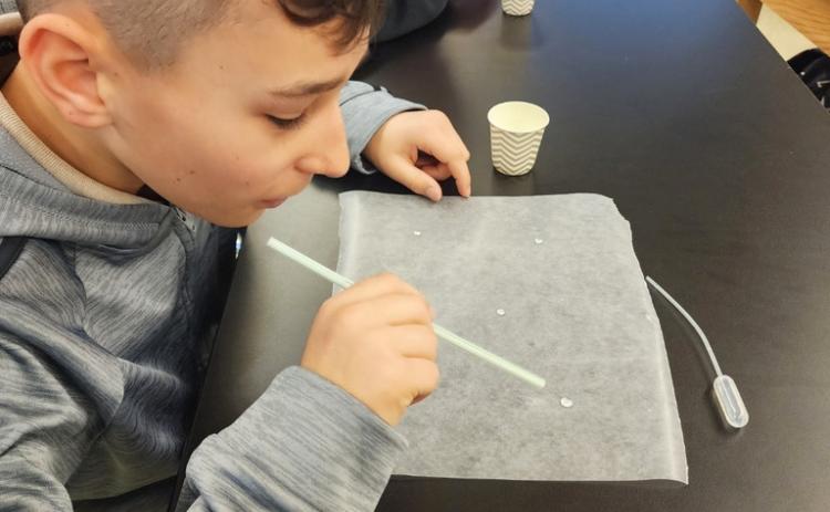 The Mullen sixth graders are studying weather. Last week in Mrs. Jewell’s class, they learned about how water droplets will interact with one another, and how that impacts our weather in the atmosphere. Pictured are Gunner Brown and Justin Kraus. Tawn Jewell