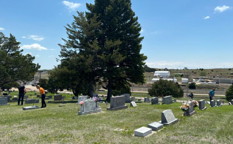 Mullen’s Cedarview Cemetery was buzzing with activity Sunday afternoon, May 19, as over 25 community members of all ages pitched in to help mow, weed eat and dig cactus. The Mullen Commercial Club organized the event and provided lunch for the volunteers. Gerri Peterson