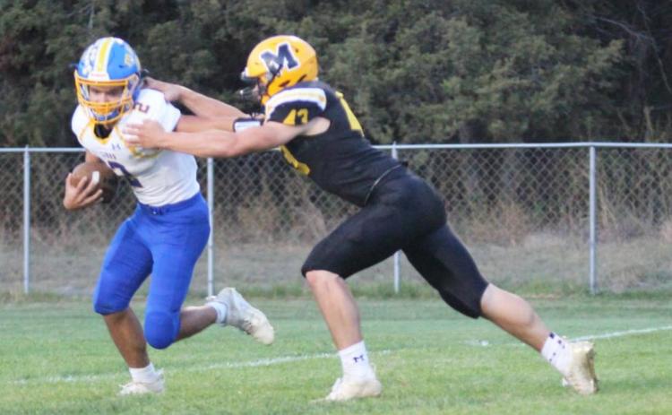 Sean Simonson with a quarterback sack last Friday night. Gerri Peterson