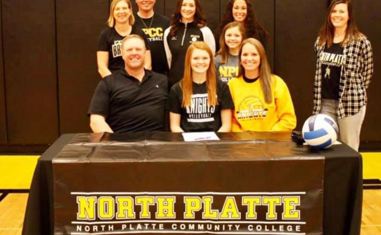 Kylie Licking is pictured seated with her parents, Roger and Sue Licking. Pictured behind her are her brother Kayden and sister Kalli, along with Mullen Head Volleyball Coach Jennifer Moore (far left), Assistant Coaches Mandi Loughran and Kay Dent and NPCC Head Volleyball Coach Alexa McCall (far right). courtesy photo