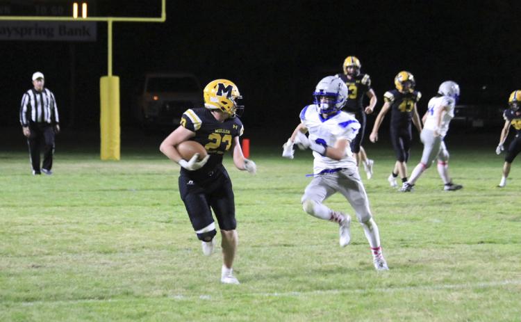 Ethan Hardin runs the ball after catching a Chase Gracey pass against Hyannis last week in the first round of playoffs. Carolee Brown