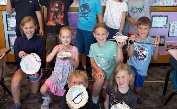 2nd graders make bird feeders