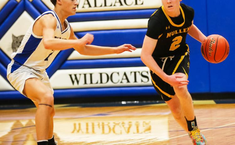 Brandon Hardin brings the ball up the court at Wallace. Megan Andersen