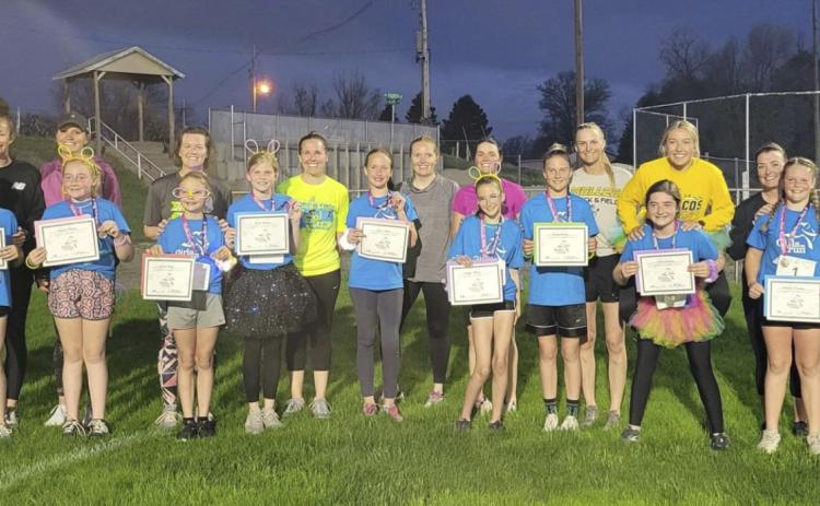 Girls on the Run participants and Buddy Runners after their 5K Glow Run last Friday night. The girls were coached by Bri Moore and Brynn Burney. courtesy photo