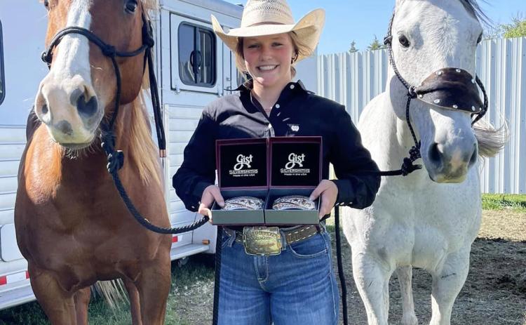 Emerson Thorberg with her National qualifier belt buckles. Kendra Thorberg