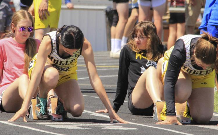 Fayth Brown (left) and Keragan Welch prepare to run the 100. Carolee Brown