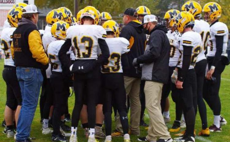 Head Coach Wade Marsh talks to his team during a time out last week at Pleasanton. Barb McIntosh
