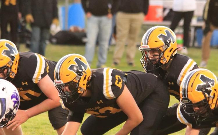 Senior Jarren Forsen ready to snap the ball to freshman quarterback Ben Werner. Carolee Brown