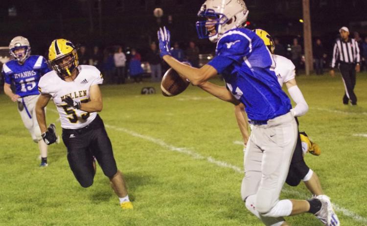 Pam Ginkens Samuel Coble and Jaden Emerson (hidden) pressure the quarterback at Hyannis last Friday night.
