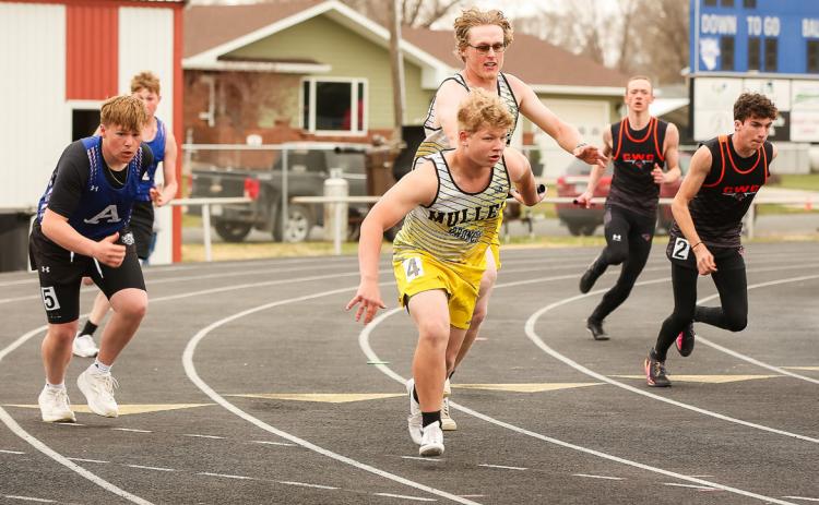 Daniel Wright hands off the baton to D.J. Coetzee during the 4x100 Throwers Relay in Arnold. Megan Andersen