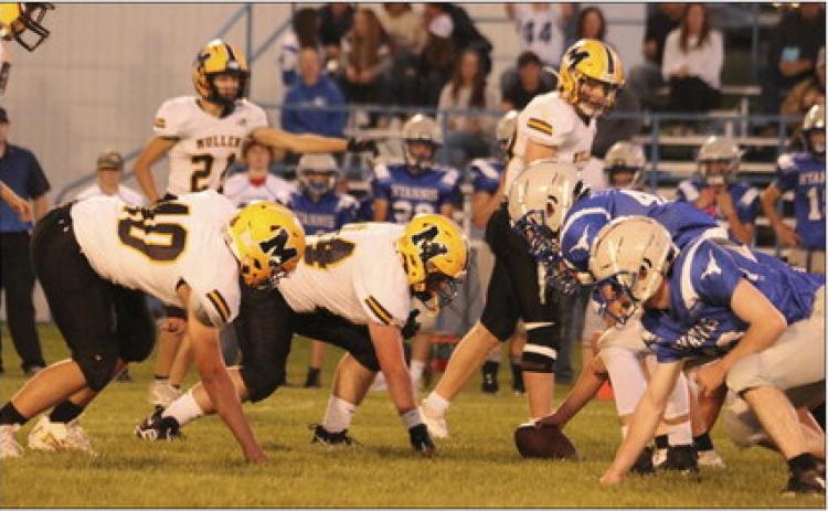 Defensive linemen James Kessler and Owen Thorberg wait for the snap in Hyannis last Friday. Carolee Brown