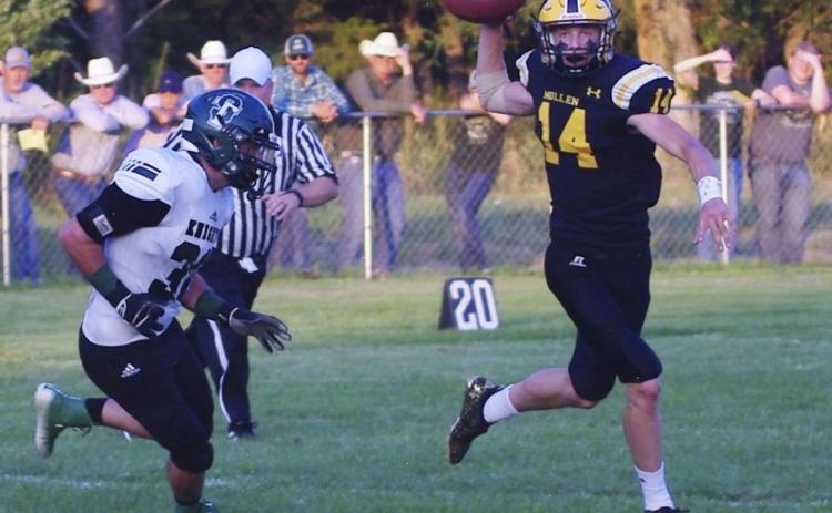 Quarterback Clayton Moore looks for a receiver last Friday night. Pam Ginkens