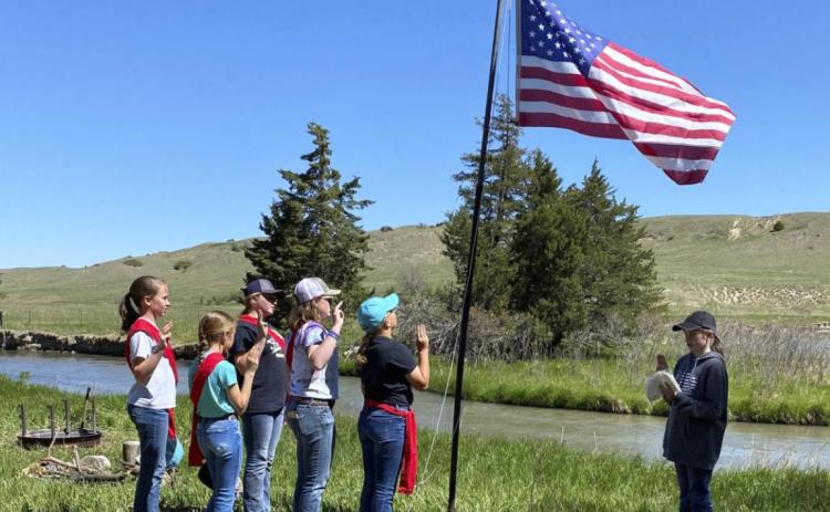 A flag ceremony at Girl Scout Day Camp. Sooky Marks