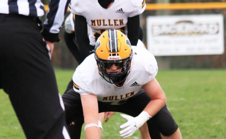 Center Daniel Wright ready to snap the ball to Bo Pettit, Jr. at Wynot last Friday. Carolee Brown Photography