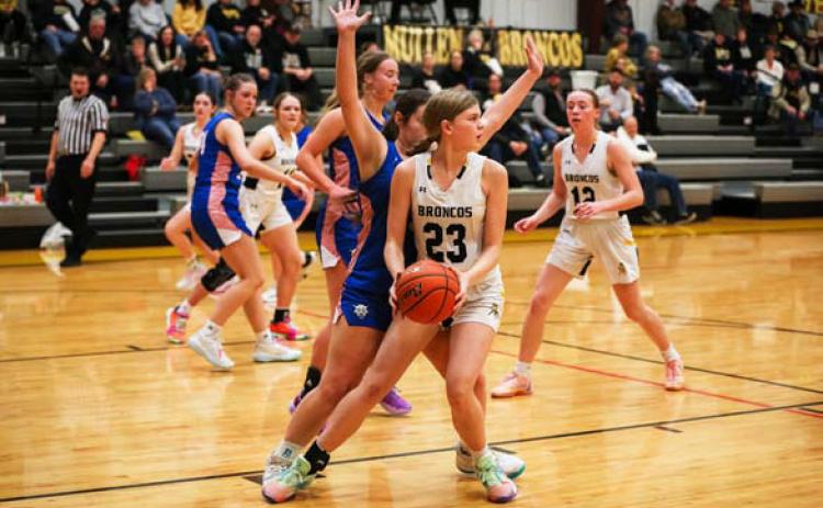 Chloe Newman looks to pass to a teammate during the Arthur game last week. Megan Andersen