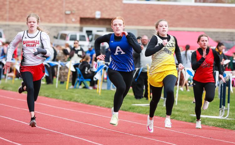Izzy Hoyt competing in the 100 in Paxton.