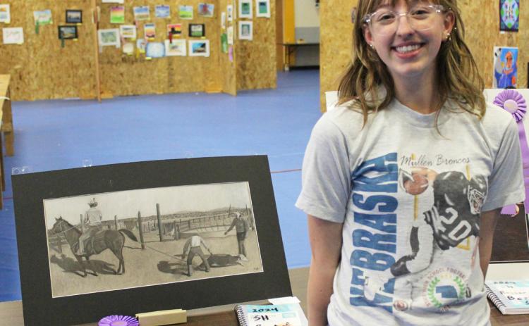 MHS senior Malia Oltmer pictured with her Best of Show piece. Gerri Peterson