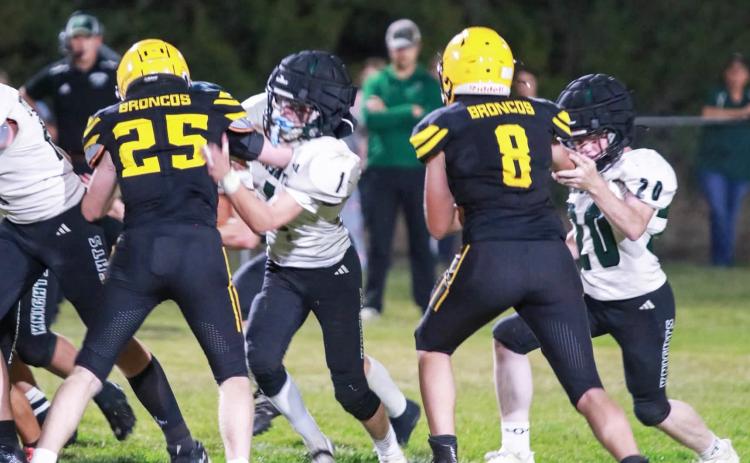 Brandon Hardin and Cort Cox look to make a tackle last week. Carolee Brown Photography