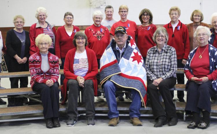 Jon Harding is pictured with the American Legion Auxiliary women following the Veterans Day program on Friday, Nov. 10, back l-r: Sherron Sullivan, Nancy Hicks, Mary Jane Younkin, Sue Bonesteel, Alice Phipps, Carol Wright, Kathie Hassett, Marylin Ericksen, Mildred Szwanek, Cathy Nichols, Winnie Cooley. Front: Kathy Tuton, Eva Crawford, Jon, Mary Lou Harding and Doris Starr. Gerri Peterson