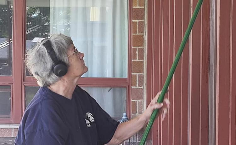 Connie Devine cleaning the windows! We appreciate it so much!