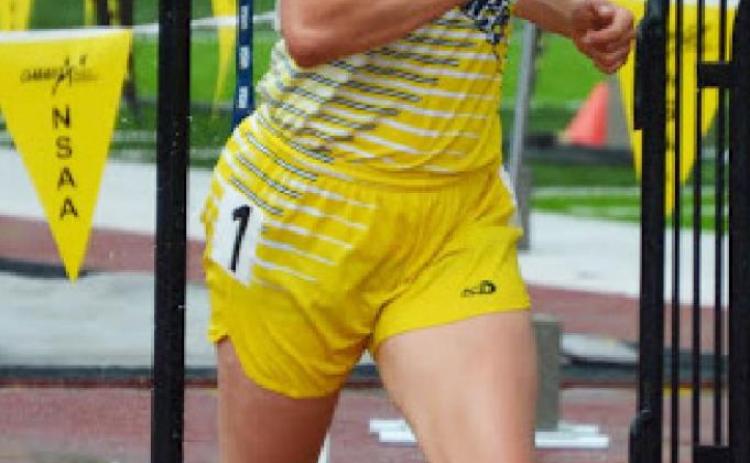 Callie Coble runs to the gold medal in the rain during the girls 3200 at State Track
