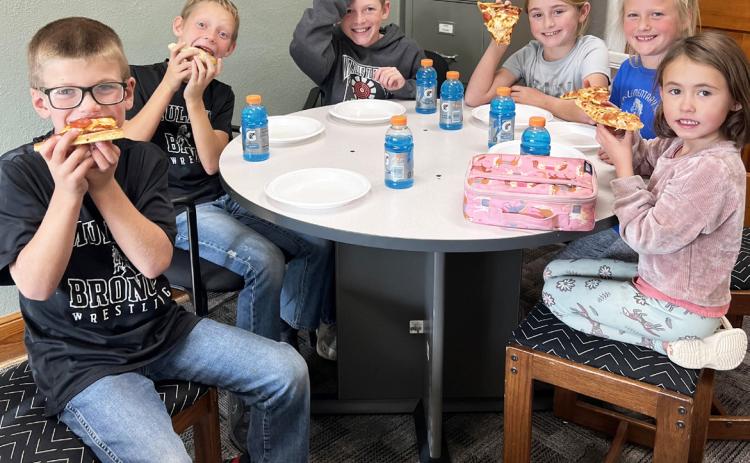 Pictured around the table, l-r: Cooper Ourada, Eli Barnes, Duke Miller, Avery Vinton, Danielle Peterson, Addison Mundorf. Brett Mauler