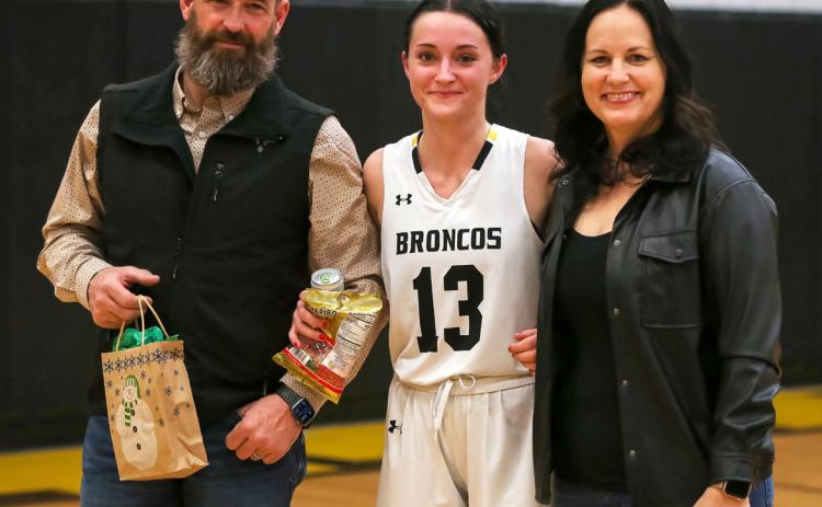 Senior Fayth Brown with her parents, Matt and Carolee, during Senior Parent Night last Friday. Megan Andersen