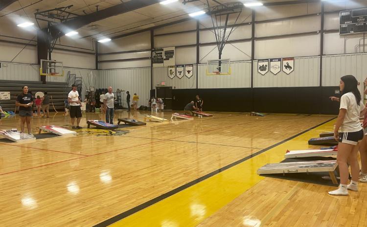 Part of the cornhole tournament in action, with Chris Kuncl and Kyle Bloom named the champions.