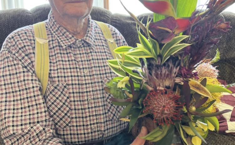 Frank Harding holds a Hawaiian bouquet that was shipped to him for his 100th birthday from his niece Rita Fischer, who was wintering in Hawaii. Frank tried encouraging the Tribune to be done running his photo by saying, “I’ve had my photo in the paper enough over the years.” But the Tribune made no promises! Gerri Peterson