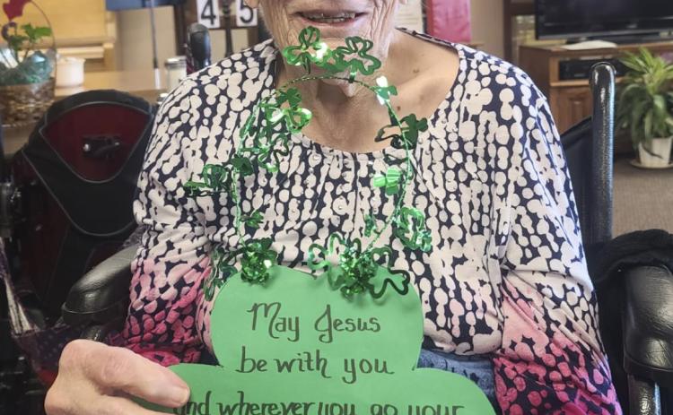 Marlene Dykes showing the March door decorations made by the Sandhills Community Bible Church. Thank you!