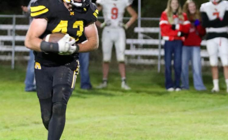 Jason Kraus carries the ball against Sandhills Valley last Friday. Carolee Brown Photography
